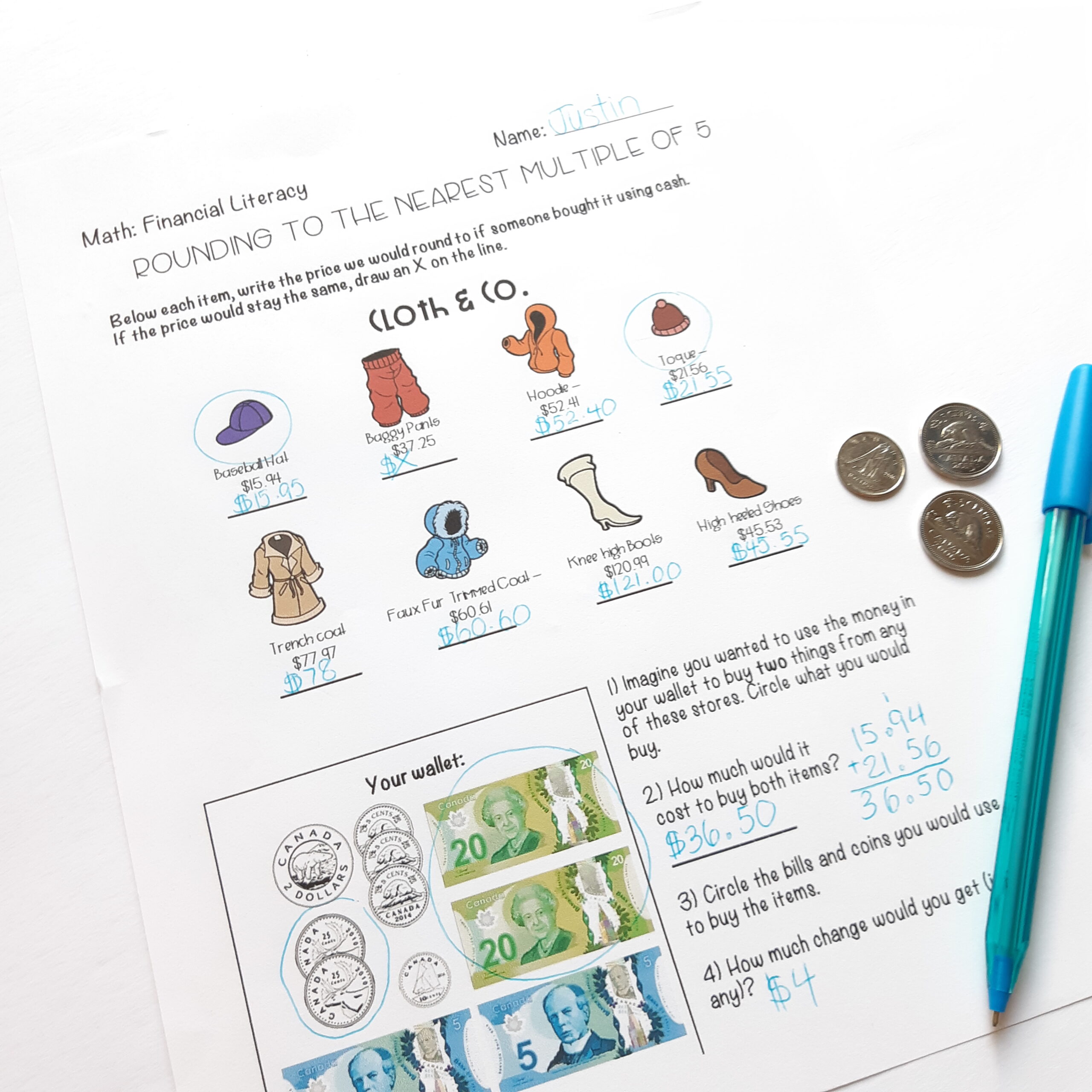 Canadian money math worksheets where students practice rounding money to the nearest coin. The top has pictures of clothing with prices that students need to round. The bottom shows money in a 'wallet' box and asks students to say which items they could buy with the money in their wallet.